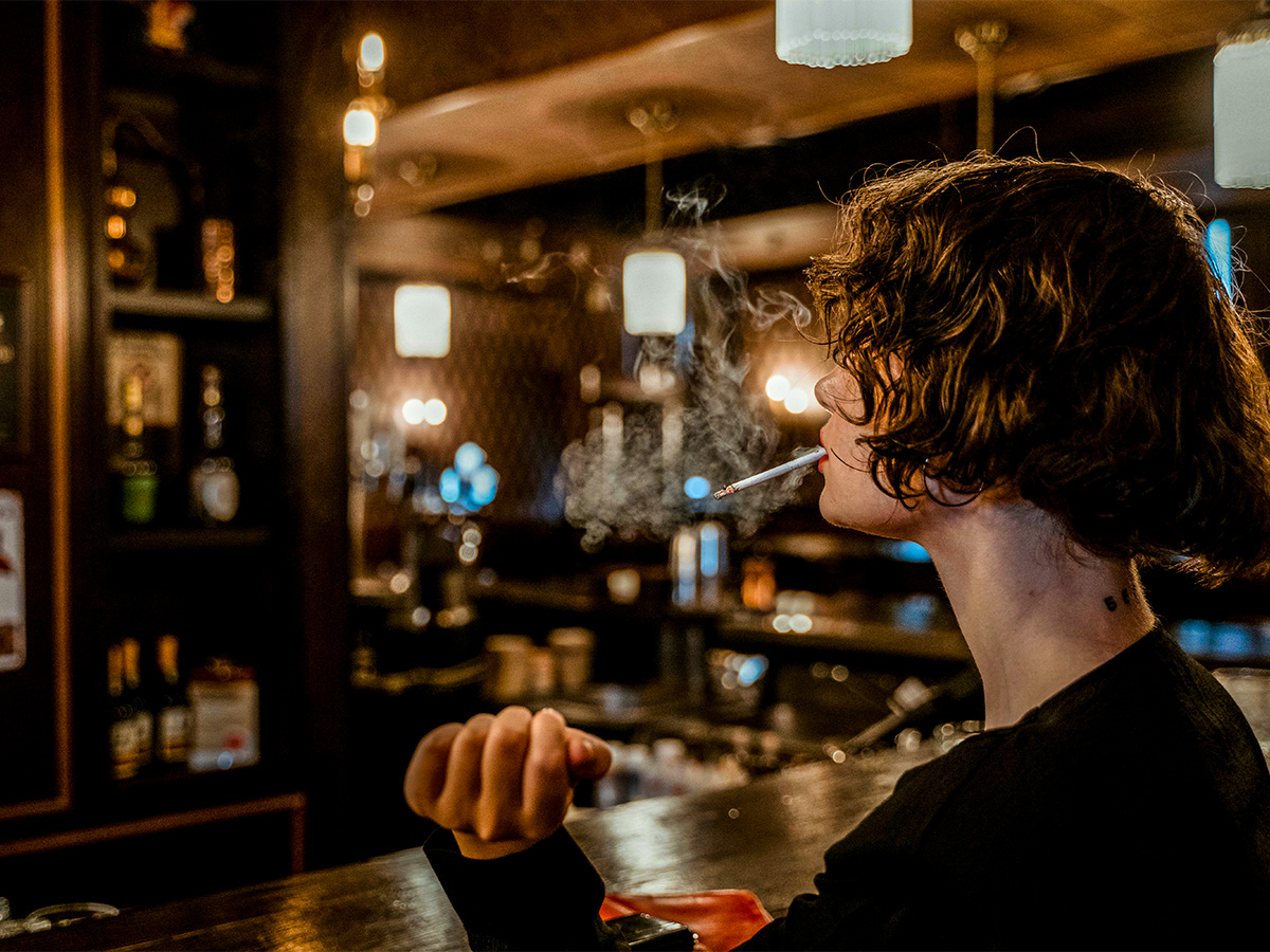 Girl Smoking in Bar